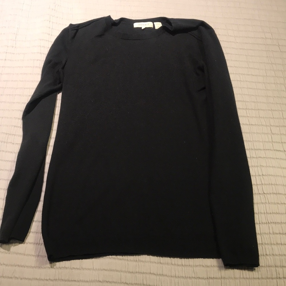 Black sweater. More form fitting